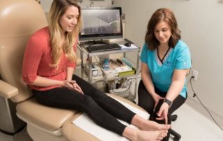 Patient getting bunion examination at North West Surgery Center